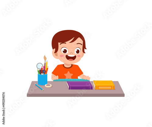 little boy holding ruler and check length
