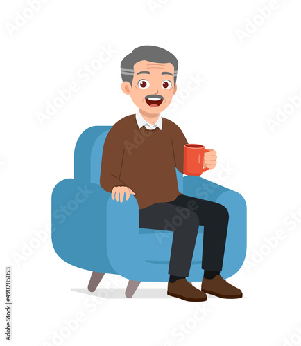 old man sit on sofa and holding cup of coffee