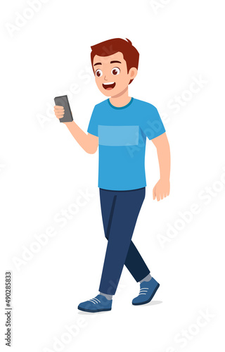 young good looking man walking and using phone