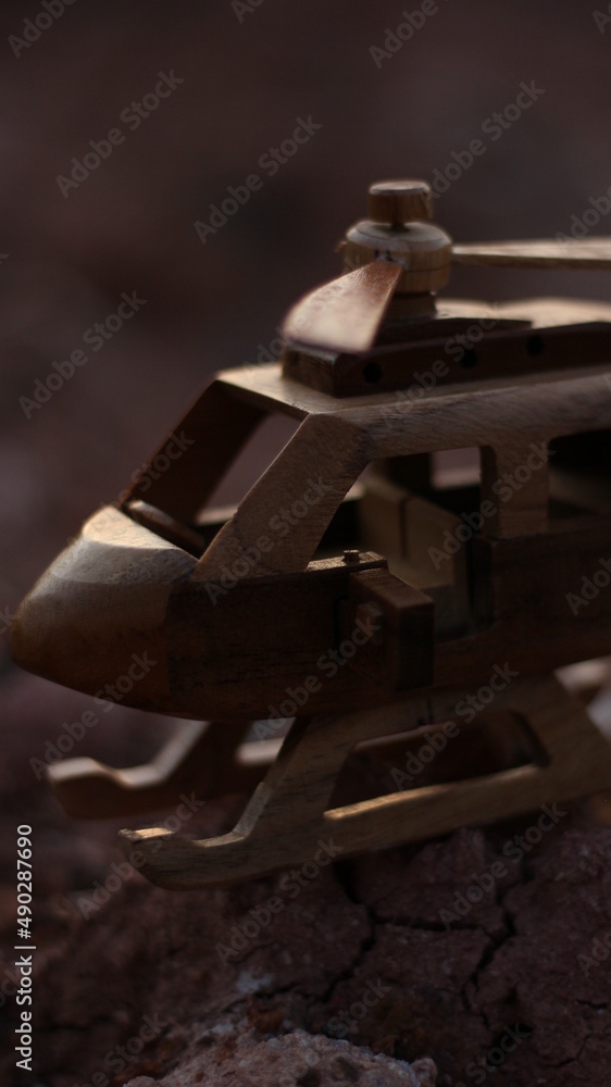 close up of a wooden helicopter miniature close up of a wooden helicopter miniature