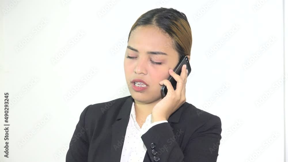 Unhappy Asian Woman Talking On Mobile Phone Unhappy Asian Woman Talking On Mobile Phone