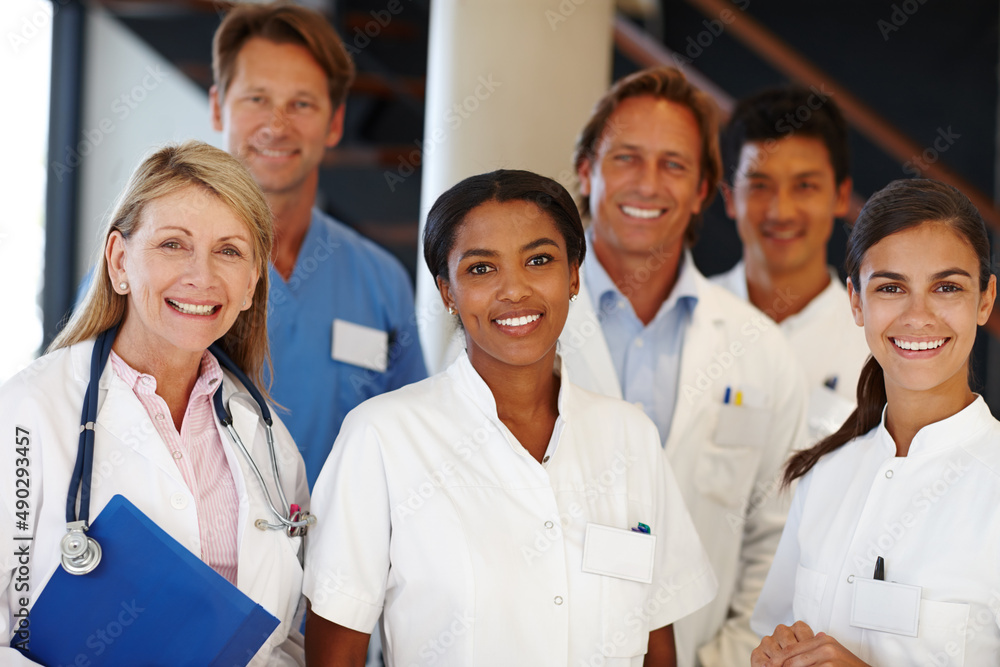 We never fail to deliver. A shot of a group of medical professionals smiling at the camera. We never fail to deliver. A shot of a group of medical professionals smiling at the camera.