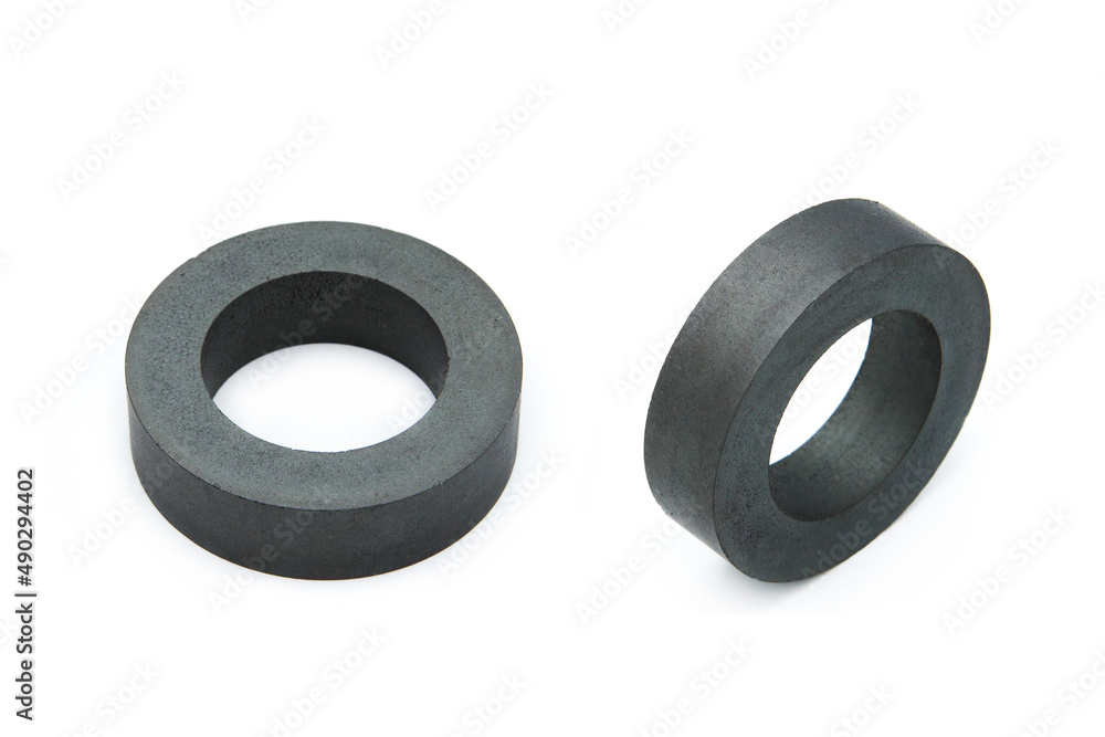 Ferrite ring isolated on white background. Two perspectives. Ferrite ring isolated on white background. Two perspectives.