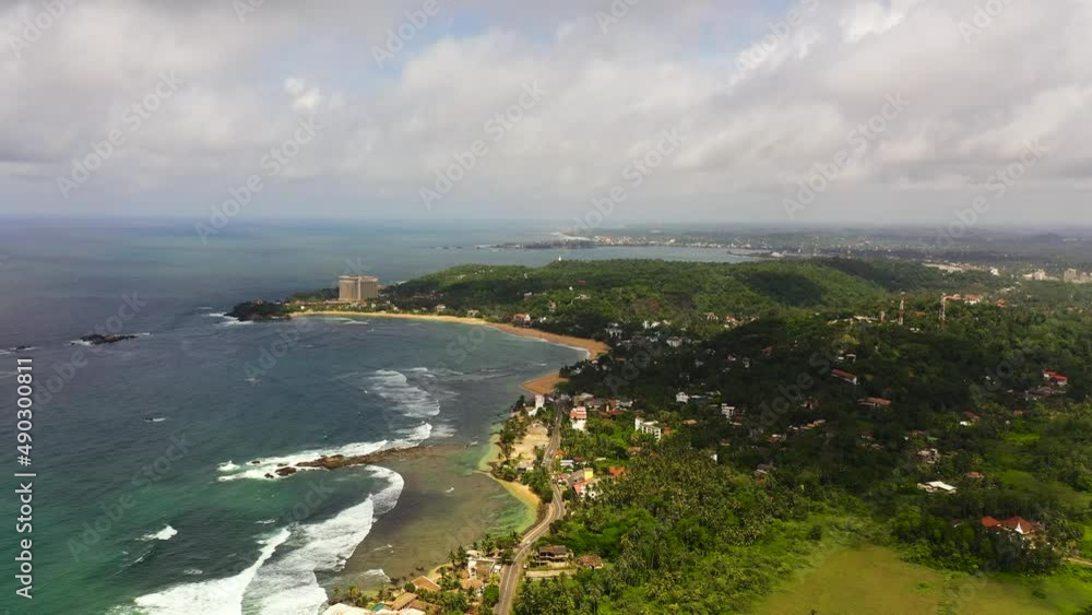 Top view of Sea coast with beaches and hotels. Tourist resort. Galle, Unawatuna, Sri Lanka. Top view of Sea coast with beaches and hotels. Tourist resort. Galle, Unawatuna, Sri Lanka.