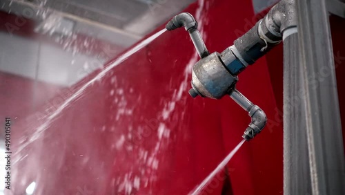 Water spray from automatic car wash machine