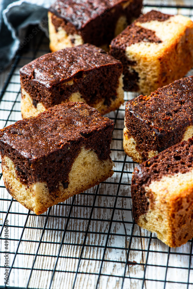 Chocolate marble cake square pieces. Serwing sweet dessert