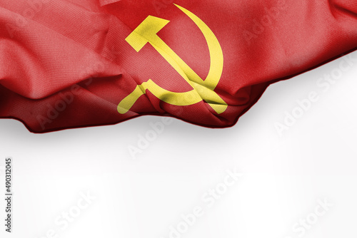 Big wavy communist flag on white background textile fabric. White negative space is suitable for placing slogans. selective focus