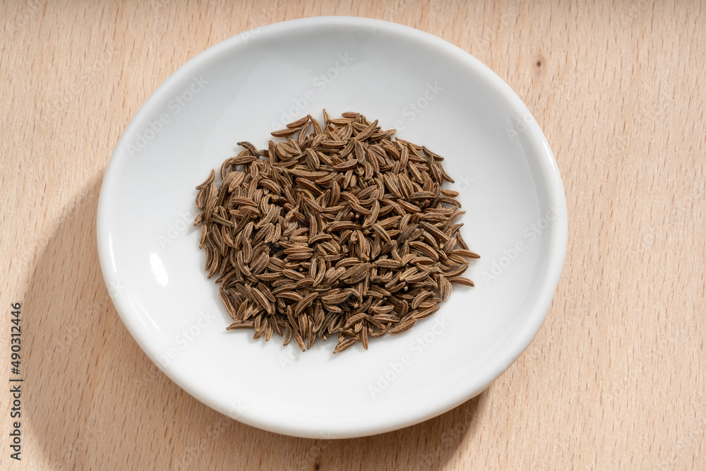 Detailed and large close up shot of caraway on a small plate Detailed and large close up shot of caraway on a small plate