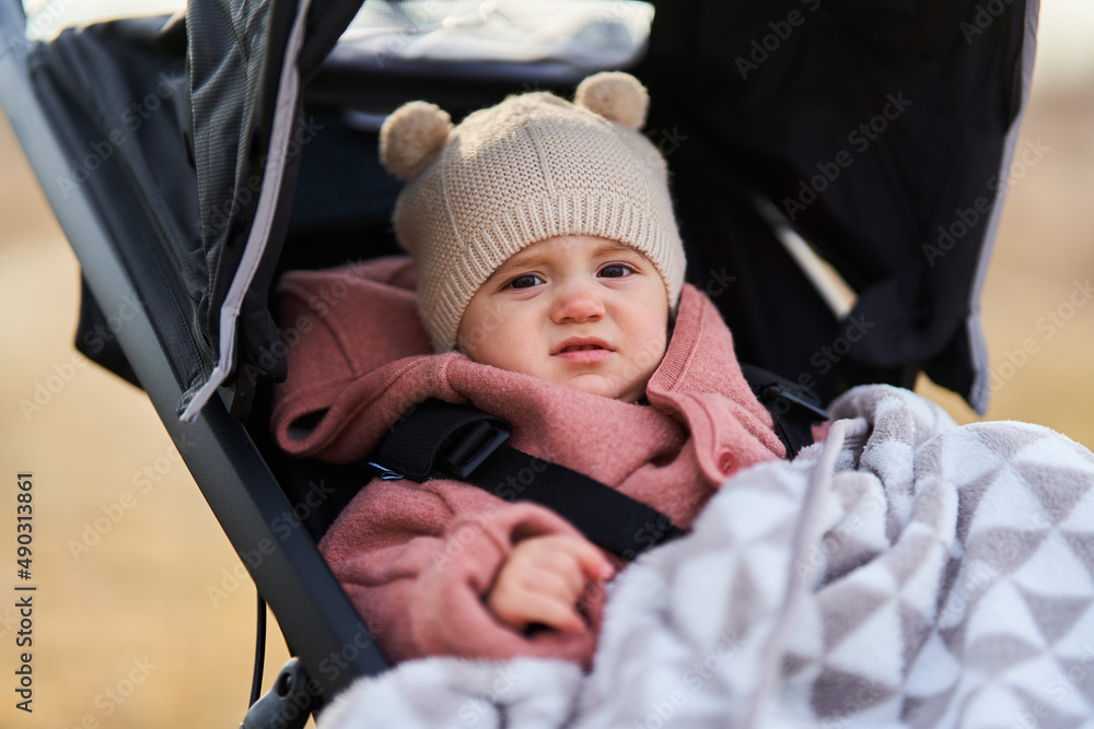 Baby girl in a buggy Baby girl in a buggy