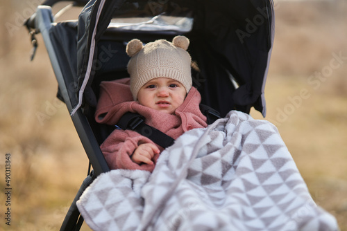 Baby girl in a buggy