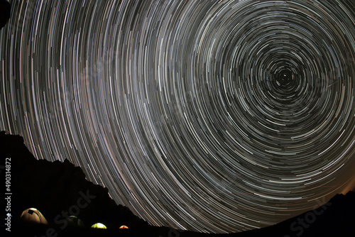 Starry sky in the mountains. Camp climbers under the starry sky.