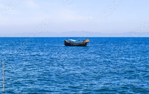 Photo of Industrial fishing boat. Fishing boat in the sea. The fishing industry in India. Indian traditional fishing boat. © NadimMahmudHimu