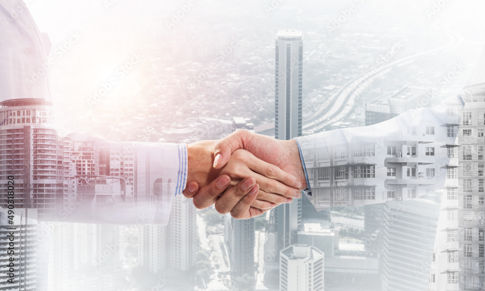 Close-up of the handshake between the two medics
