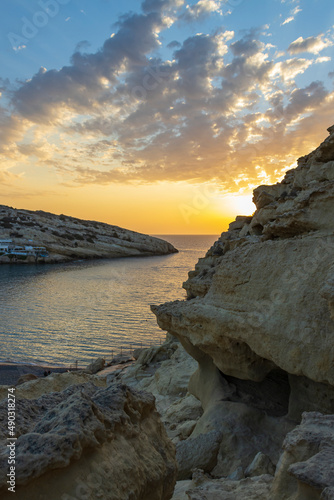 sunset on the coast in matala, creta, greece - matala sunset