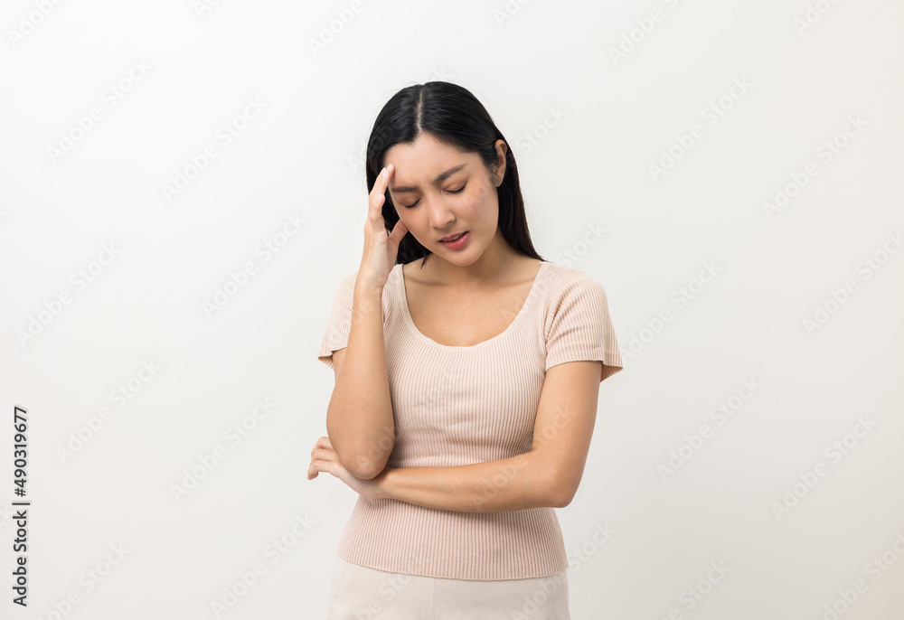 Young asian beautiful woman hand touching head she's feeling depressed stress headache be tired from working standing on isolated white background she has symptom office syndrome. Young asian beautiful woman hand touching head she's feeling depressed stress headache be tired from working standing on isolated white background she has symptom office syndrome.