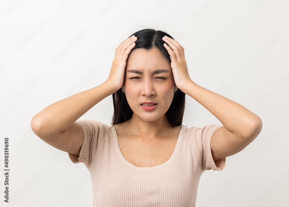 Young asian beautiful woman hand touching head she's feeling depressed stress headache be tired from working standing on isolated white background she has symptom office syndrome. Young asian beautiful woman hand touching head she's feeling depressed stress headache be tired from working standing on isolated white background she has symptom office syndrome.
