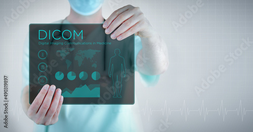 DICOM (Digital Imaging Communications in Medicine). Doctor holding virtual letter with text and an interface. Medicine in the future photo