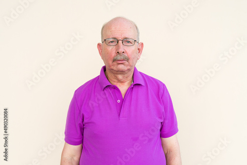 Portrait of senior man looking at camera