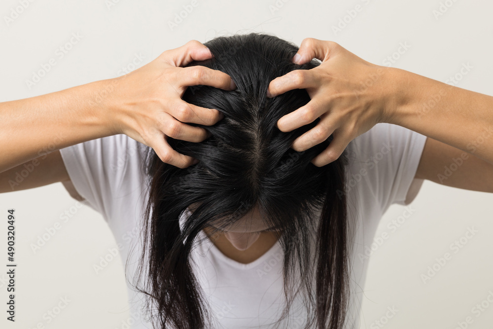 Naklejka premium Young woman itchy head There is a fungus on the scalp dandruff, red rash She scratched her head to bring relief. Need to consult a doctor. Hair problems hair loss. Shot on isolated background