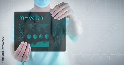mHealth. Doctor holding virtual letter with text and an interface. Medicine in the future photo
