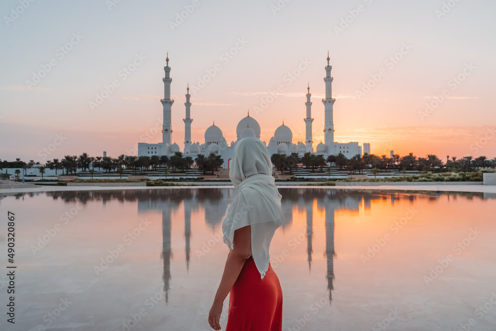 Arab woman in front of a mosque
