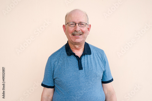 Portrait of senior man looking at camera while smiling