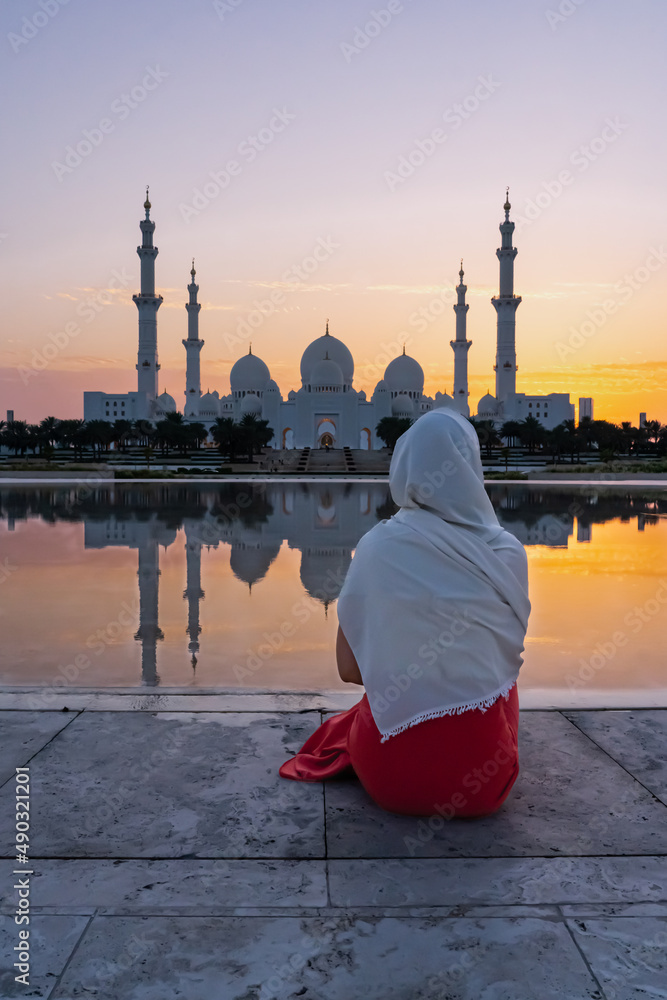 Arab woman in front of a mosque