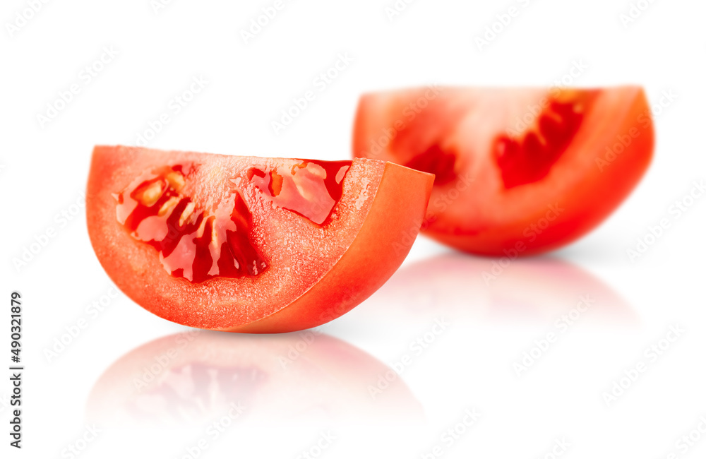 two slices of tomato on a white isolated background two slices of tomato on a white isolated background