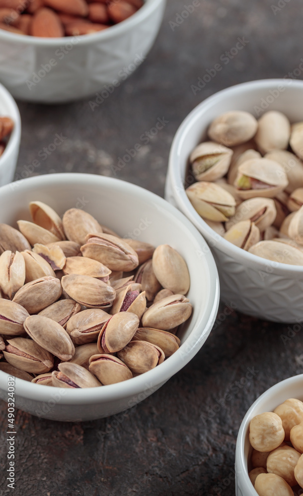 Organic pistachios on a dark background Organic pistachios on a dark background