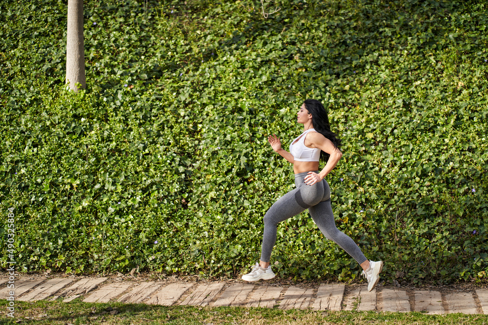 Fototapeta premium a sportswoman running in the park