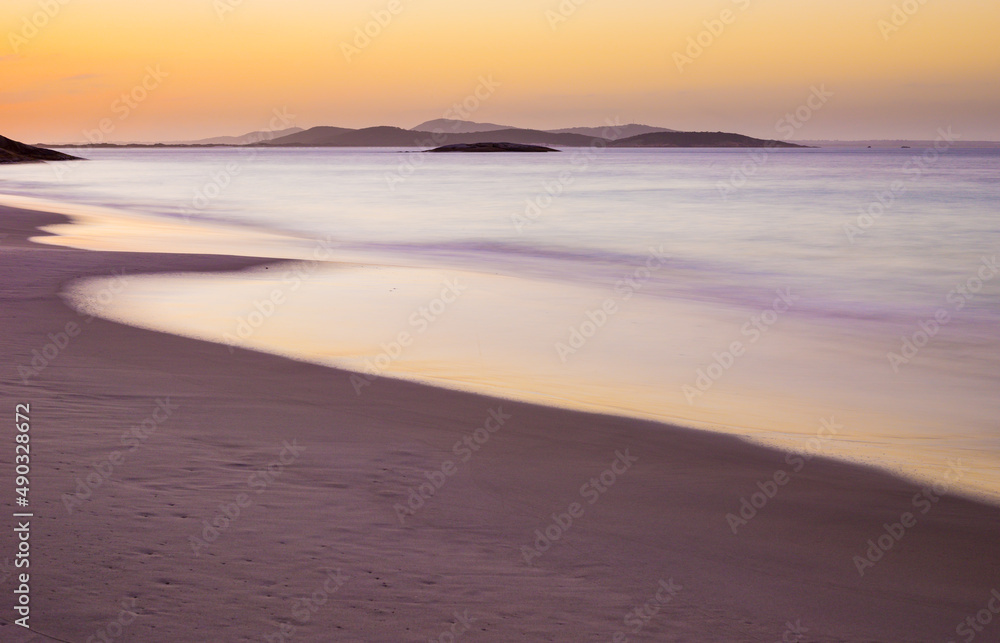 long exposure image of a sunset over a beach in Torndirrup National Park, Western Australia
