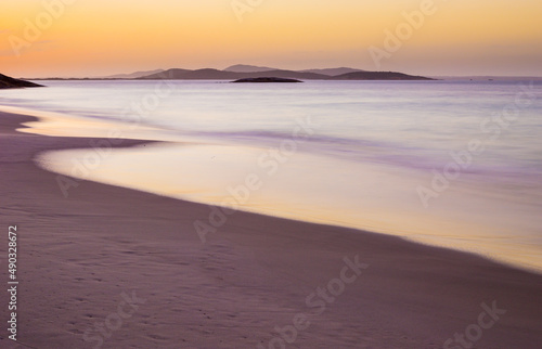 long exposure image of a sunset over a beach in Torndirrup National Park, Western Australia