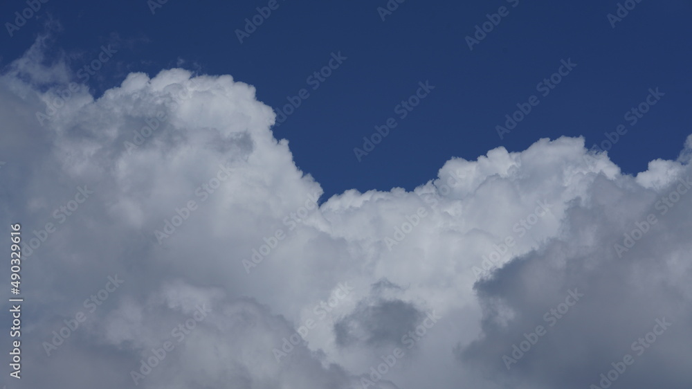 The beautiful summer sky view with the white clouds and blue sky in the sky The beautiful summer sky view with the white clouds and blue sky in the sky