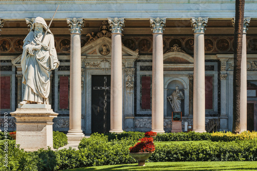 Gardens of the Basilica of Saint Paul in Rome showing the Statue of Saint Paul. photo