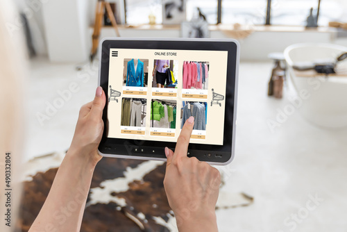 Woman shopping for clothes online. woman using tablet