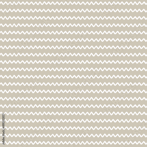 Seamless repeating pattern with hand drawn wavy spiral lines, handwriting imitation, on beige background for craft, apparel, home decor