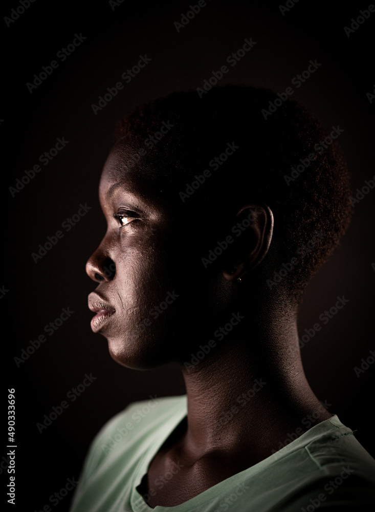 Naklejka premium Beauty face. Smiling black woman portrait. Beautiful candid real face African American girl High quality photo