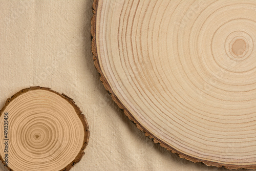 Rustic, wood texture background. Dramatic light, natural pattern. Cozy soft winter vintage background. Beige Vintage towel, flat lay.	