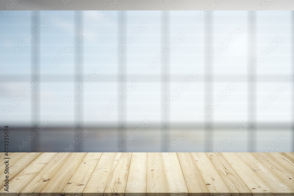 Empty office wooden table with clear modern interior with large window on background, close up, mockup Empty office wooden table with clear modern interior with large window on background, close up, mockup