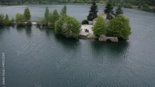 Little church in the middle of lake doxa. photo