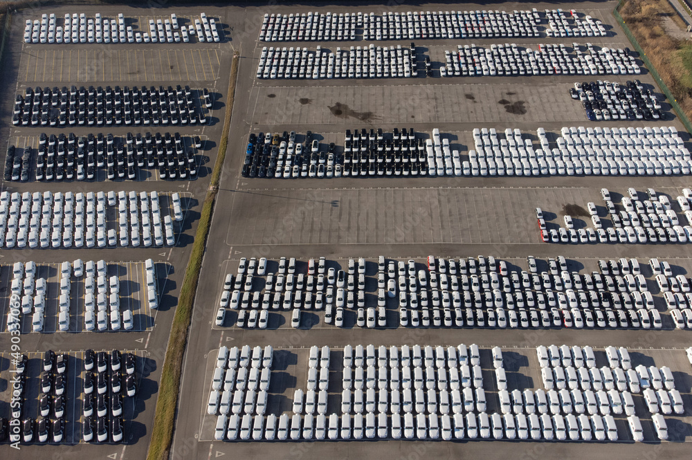 Aerial view of thousands of cars parked in port ready to be distributed Aerial view of thousands of cars parked in port ready to be distributed
