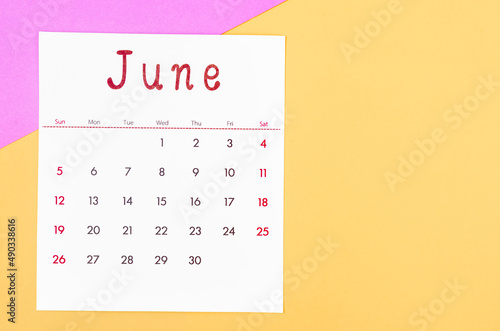 June 2022 calendar on multicolored background.