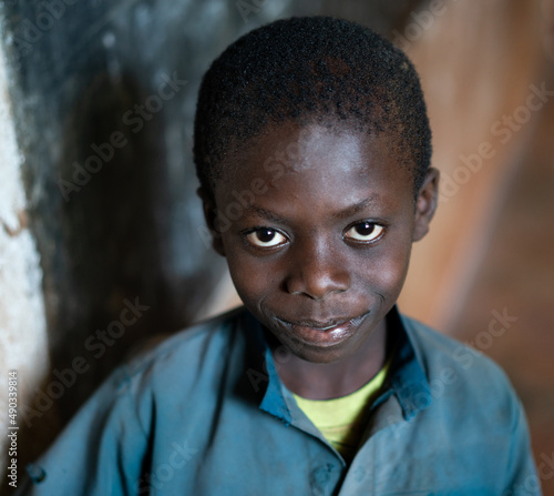 Close-up Portrait of African black Boy portrait inside of school classroom. High quality photo