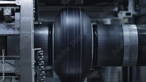 Automated tyre production technology view at modern industrial factory closeup photo