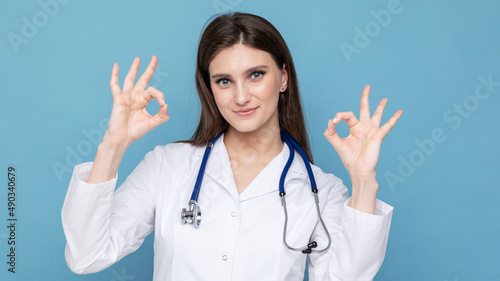 Portrait of a young female doctor with good news