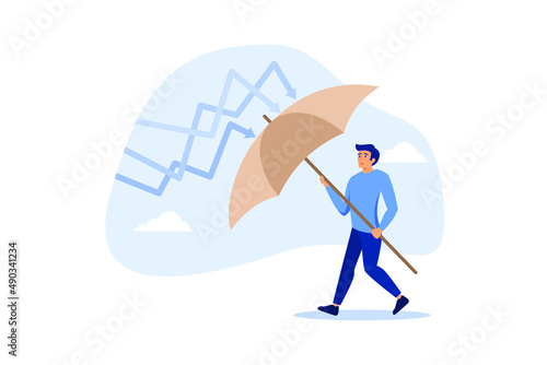 Protection or defensive stock in economy crisis or market crash, business resilient to survive difficulty or insurance concept, businessman holding umbrella to cover and protect from downturn arrow.