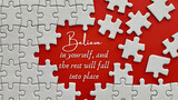Top view of motivational quote on red cover - Believe in yourself, and the rest will fall into place. Jigsaw puzzle missing pieces background.