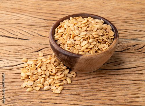 Fried soy beans snack in a bowl over wooden table