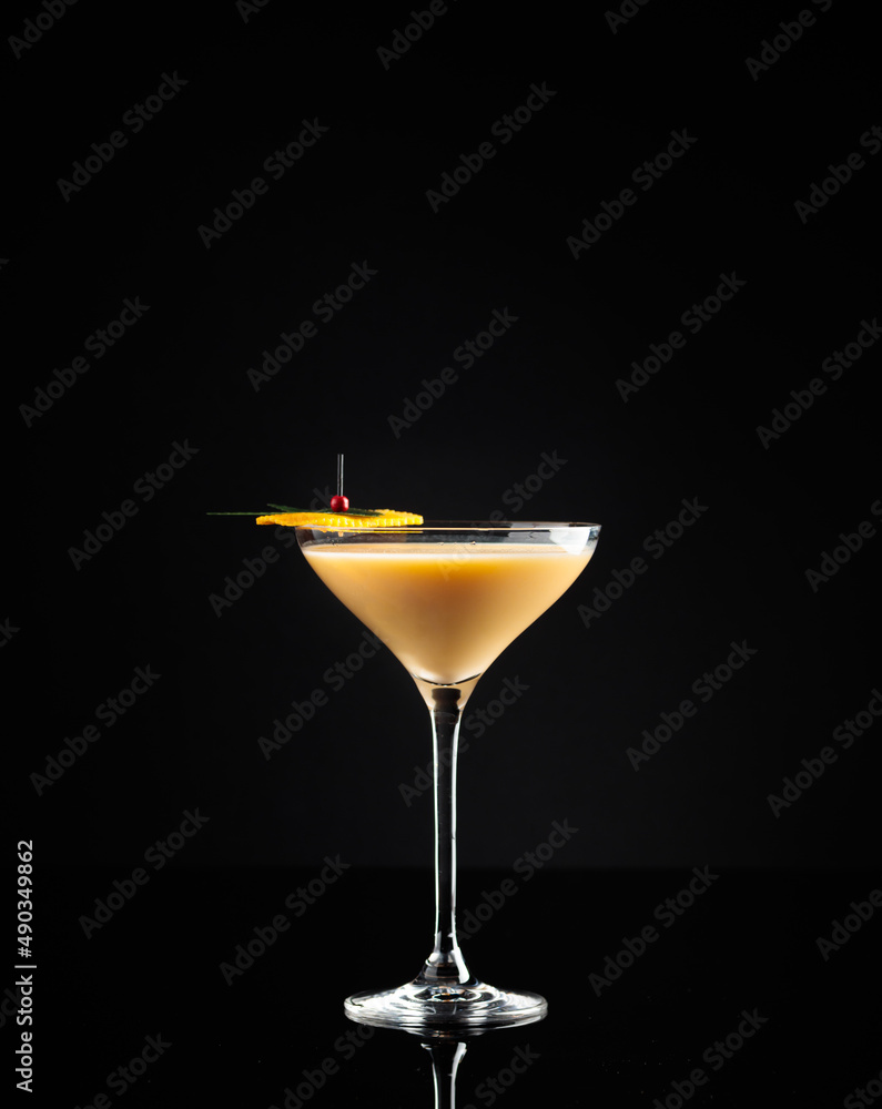 Cocktail in a glass on a black background Cocktail in a glass on a black background