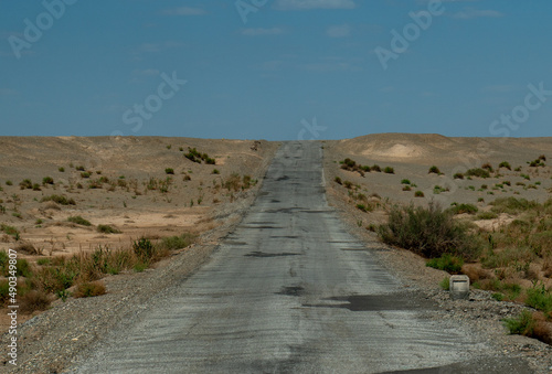The road in the desert. in Dunhuang Yardang National Geopark, Gansu China. photo